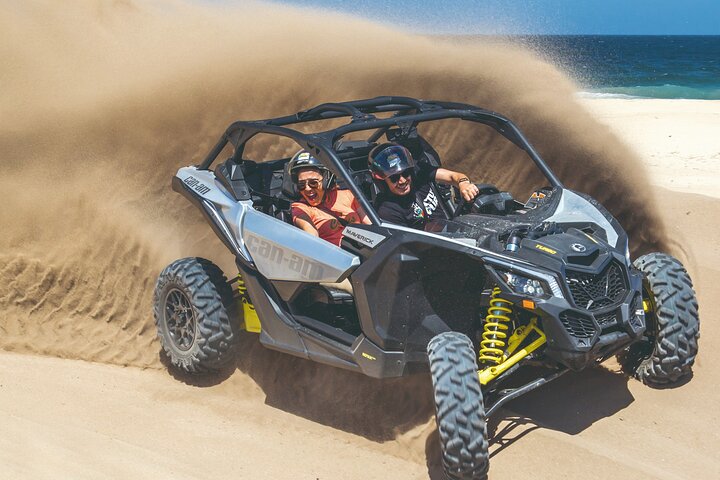 Dune buggy throwing sand