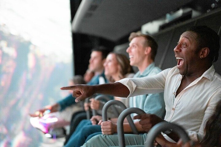 Guests on a flying theatre ride