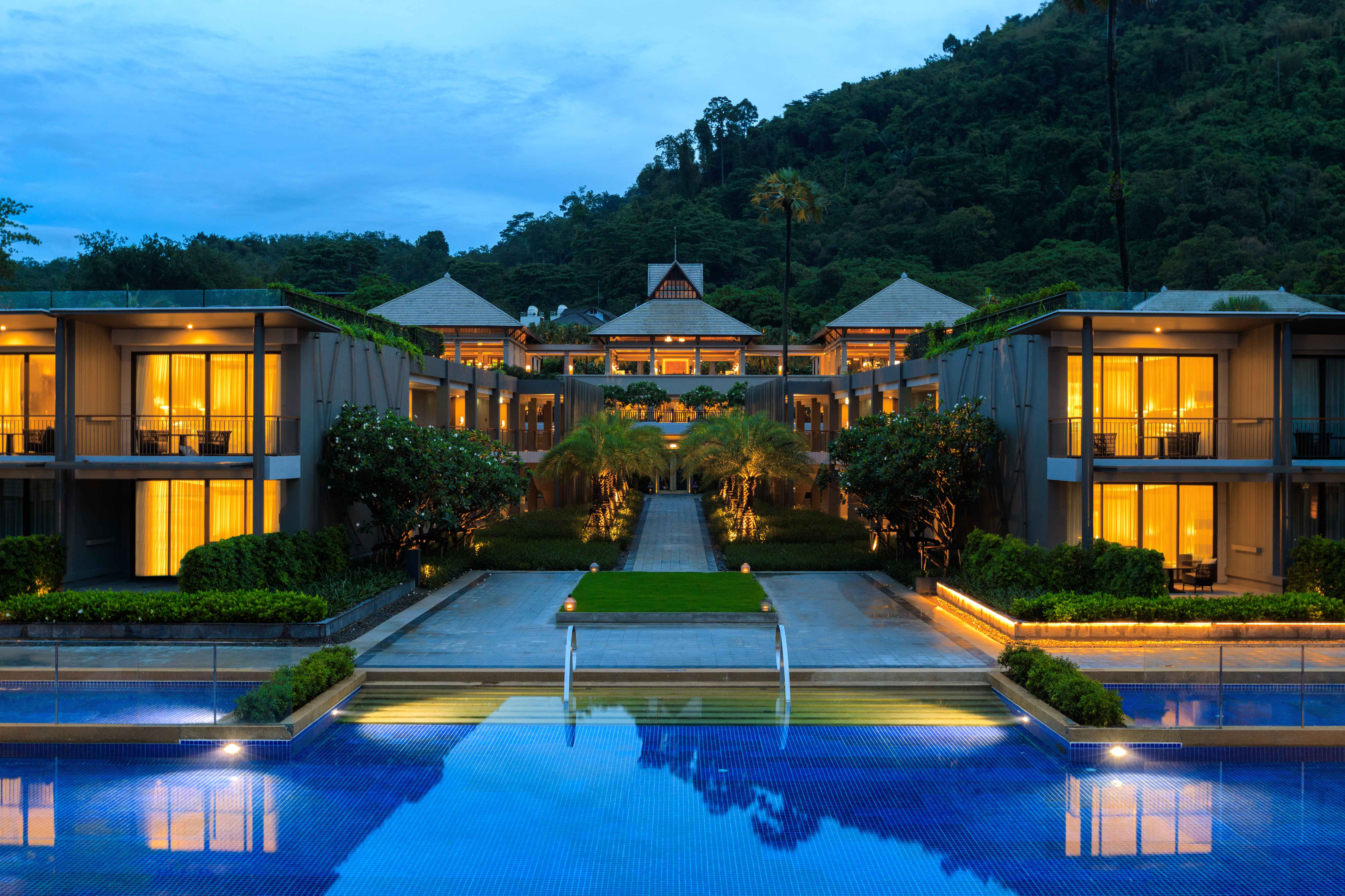 Resort courtyard lit at dusk